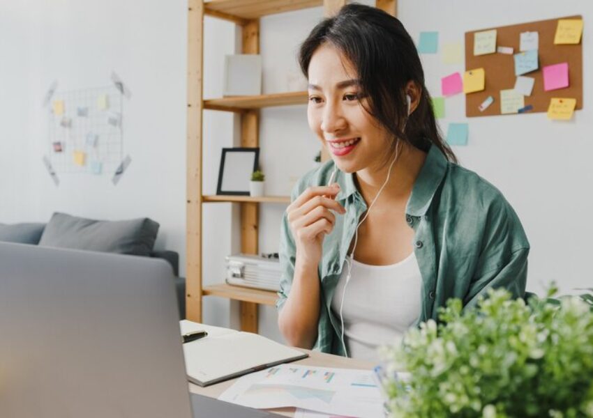 asia-businesswoman-using-laptop-talk-colleagues-about-plan-video-call-while-smart-working-from-home-living-room_7861-3159